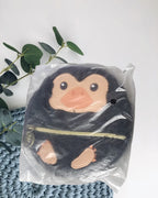 Peluche monedero escarbato