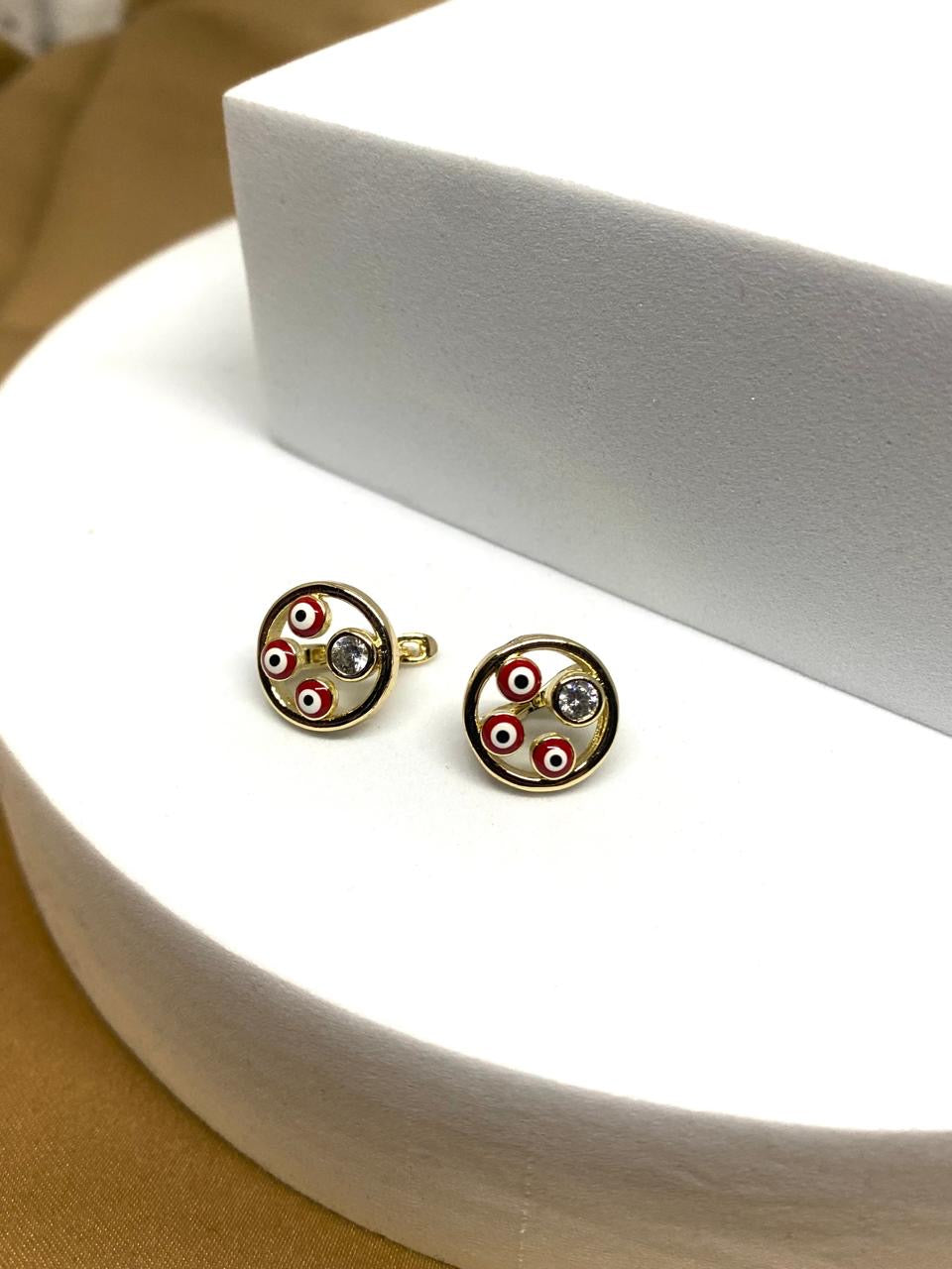 A26107  Arete ojo turco rojo Material: Oro Laminado 14k